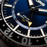 Aquis GMT Date