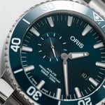 Aquis Small Second, Date