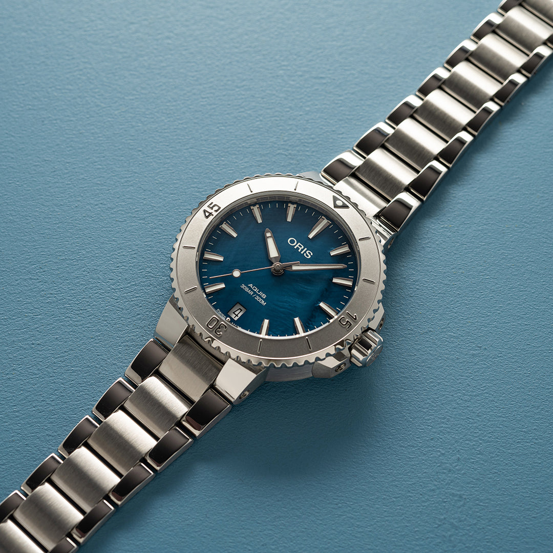 Aquis Date 36.5mm Blue Mother Of Pearl Swiss Emporium
